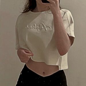 Alphalete ELMTS half sleeve pullover cream workout crop top